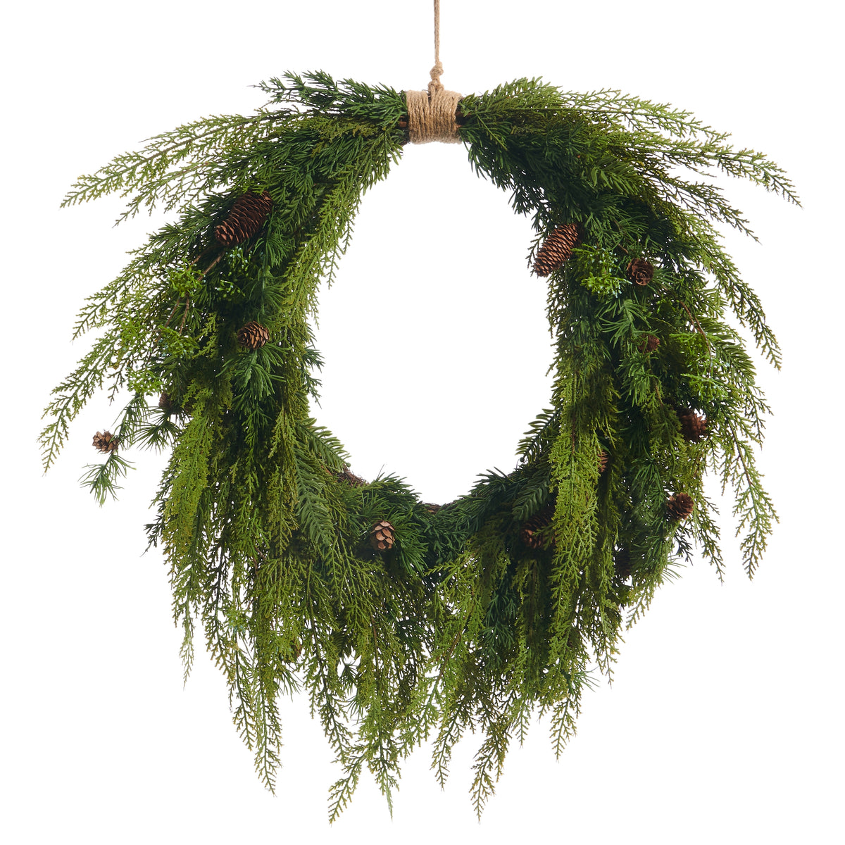 A round wreath made of plastic cedar branches with small pinecone accents.