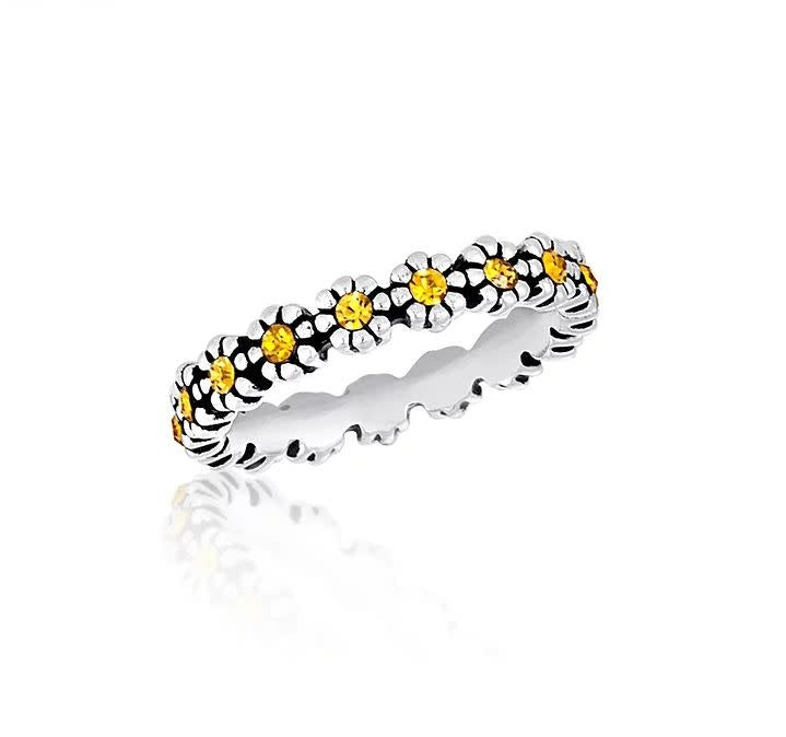 Stackable ring in silver metal with a smooth band and stacked geometric cutouts.