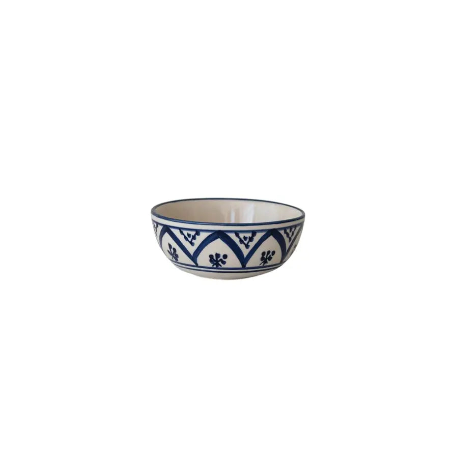 Hand-painted stoneware bowl with a decorative surface pattern.