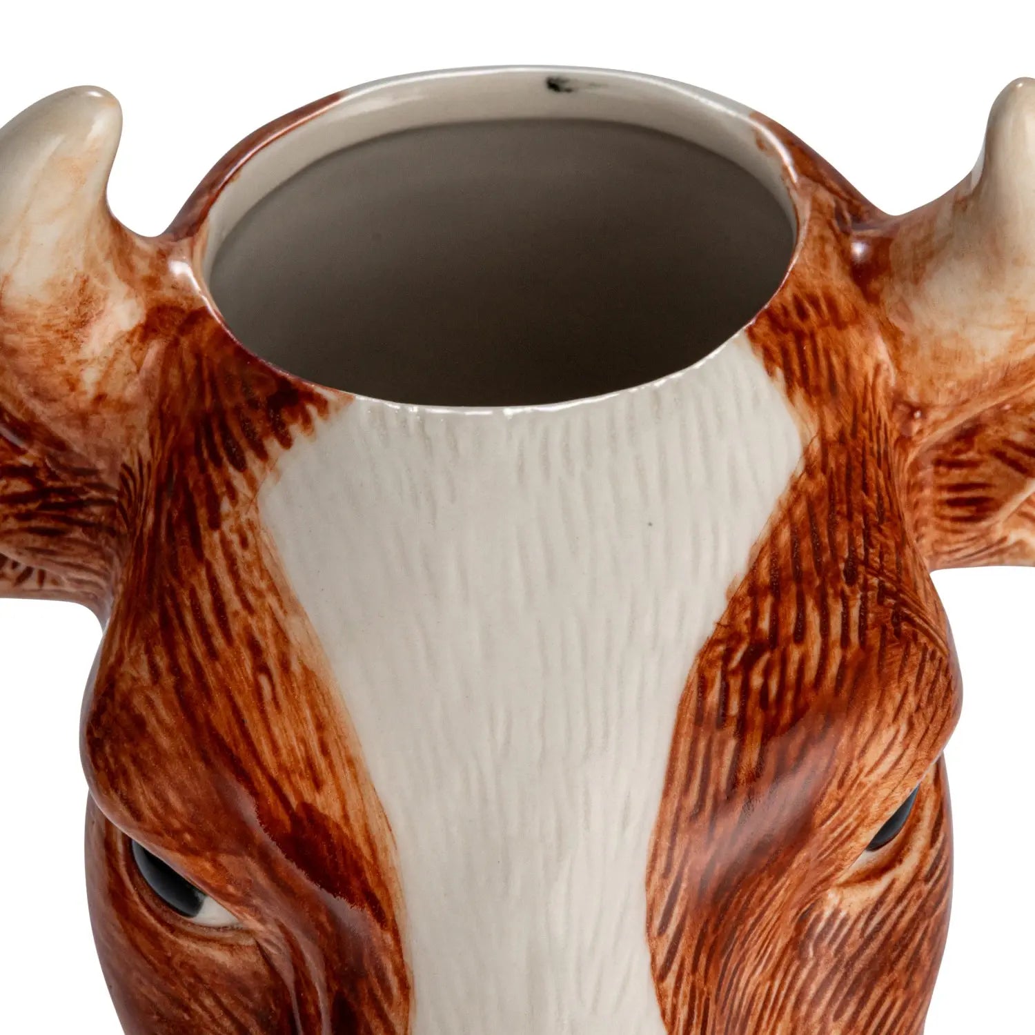 Round hand-painted stoneware cow vase with natural earth tones.