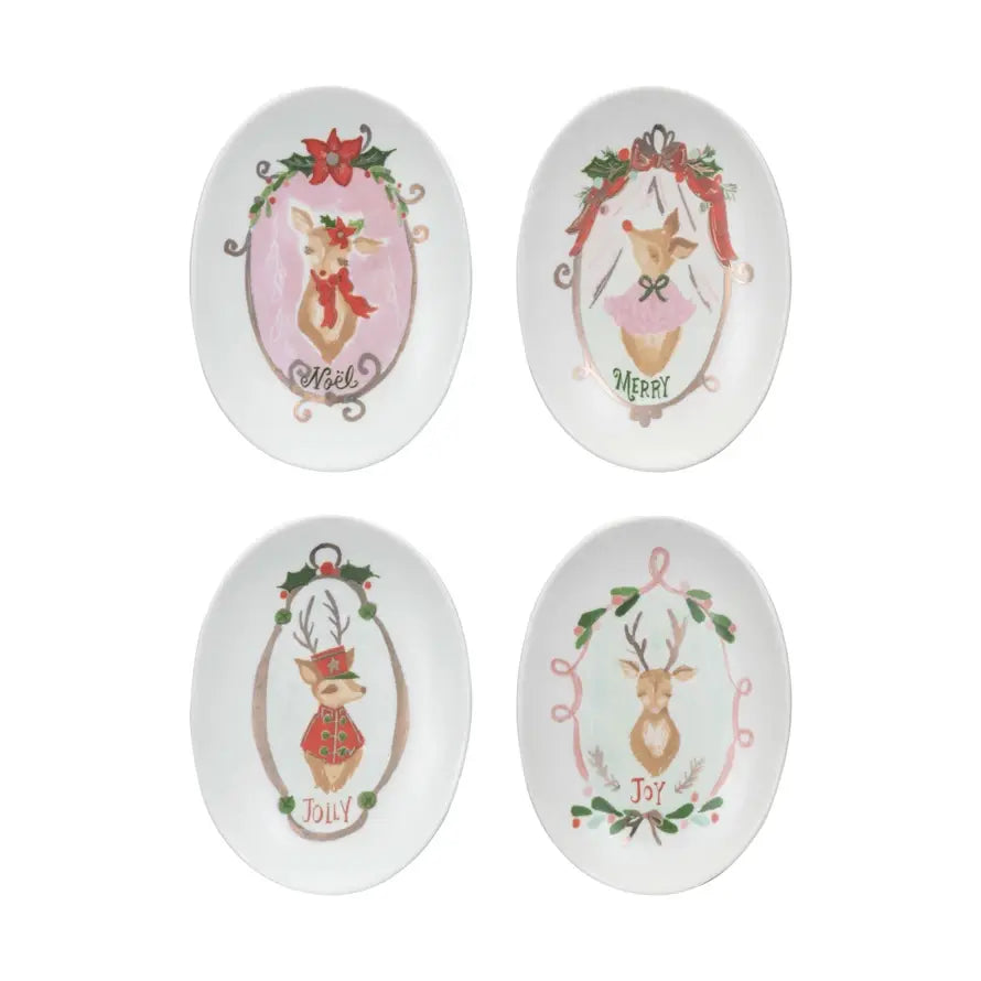 White stoneware dish featuring a brown deer illustration with holiday text.