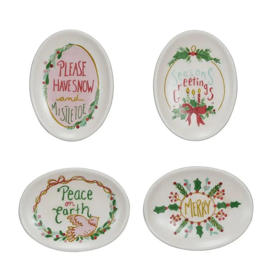 White stoneware dish with festive holiday saying text on a round rim.