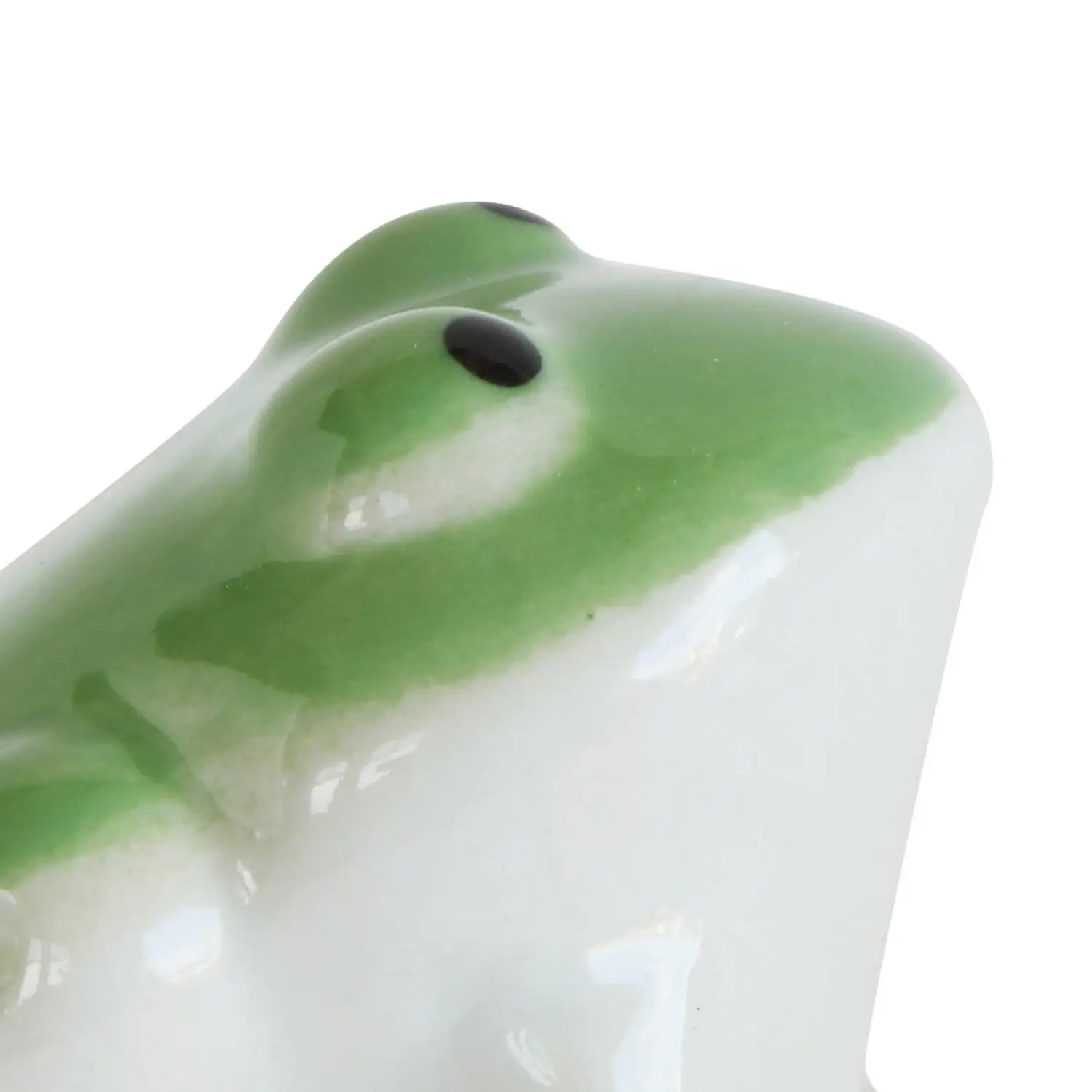 Small stoneware frog figurine in earthy tones with a floating silhouette designed to sit beneath other decorative objects.