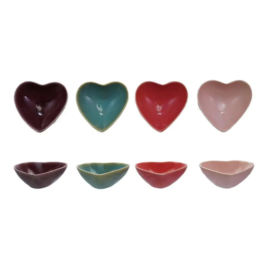 Stoneware heart-shaped dish in neutral tone with smooth rim.