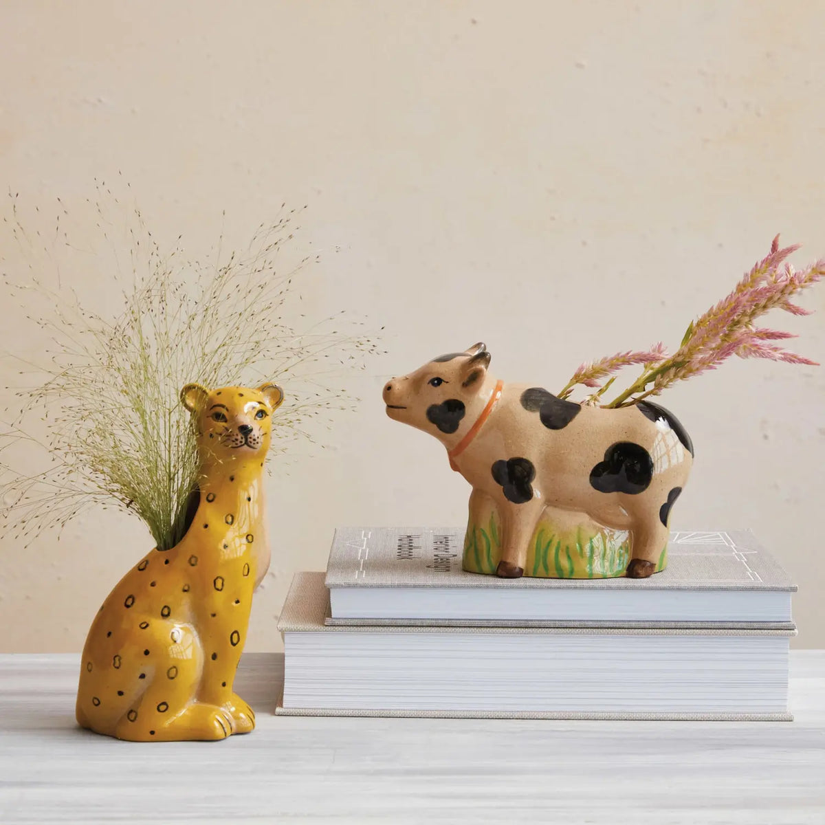 Hand-painted stoneware leopard-shaped vase with crackle glaze finish.