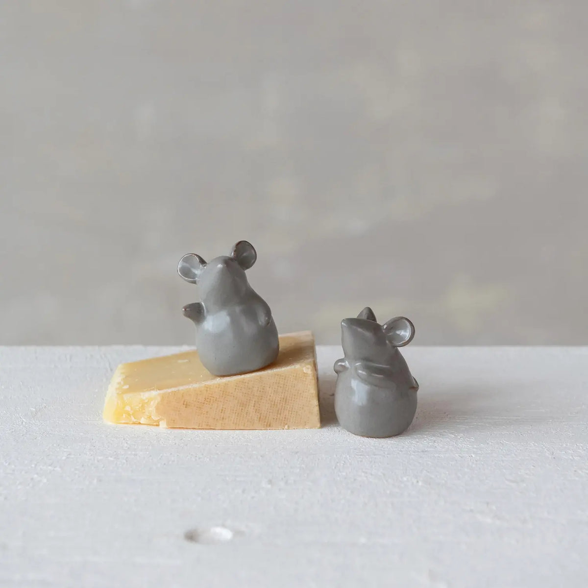Stoneware mouse figurine with reactive glaze finish in earthy tones
