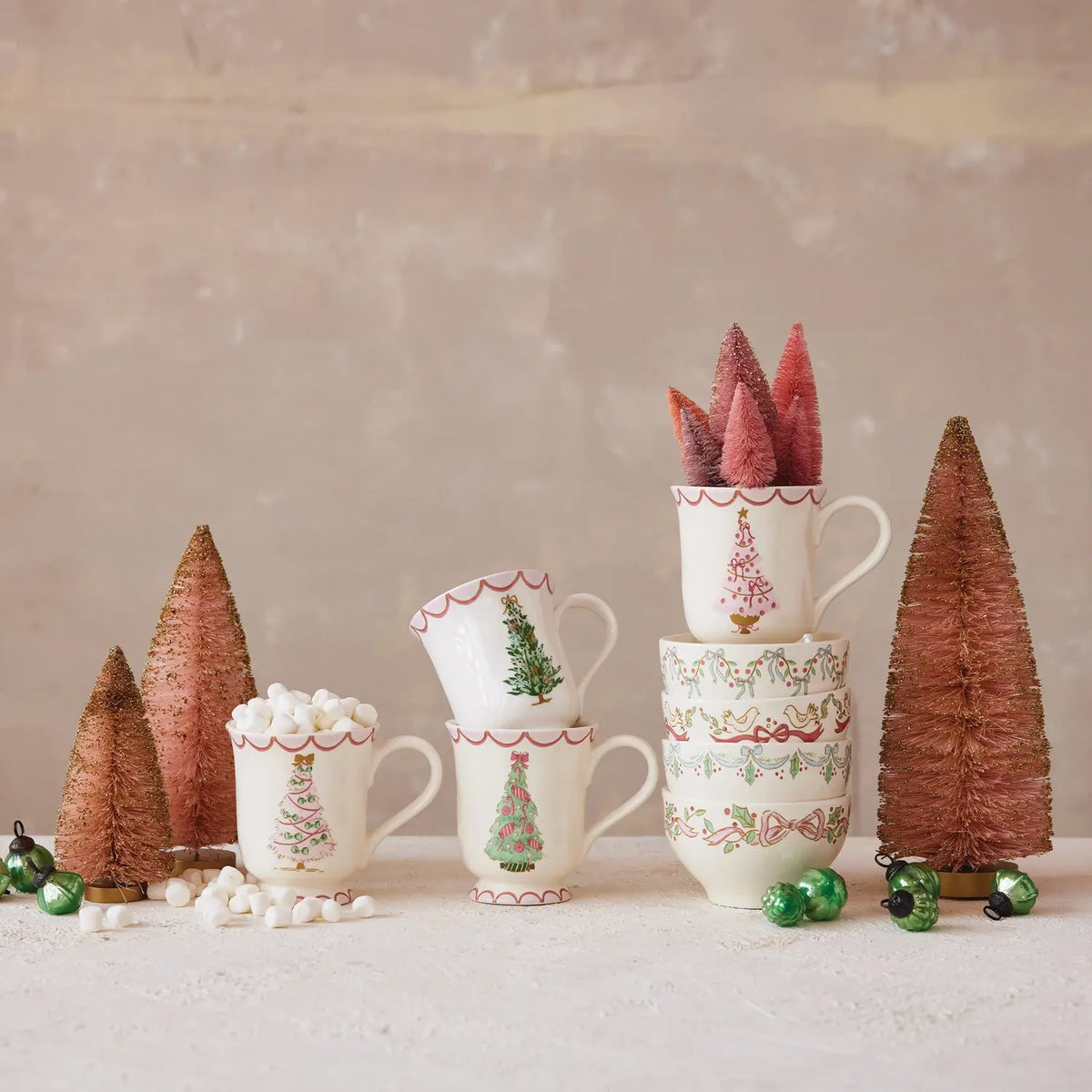 White stoneware mug with a green Christmas tree illustration on the front.