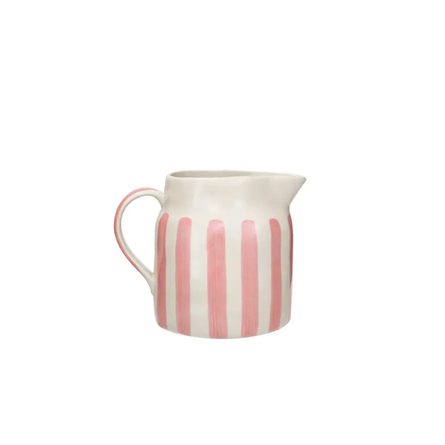 Pink hand-painted stoneware pitcher with wax relief stripes