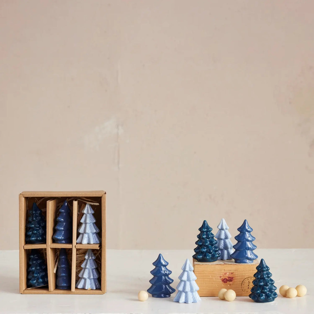 Set of blue stoneware tree figurines with a matte finish.