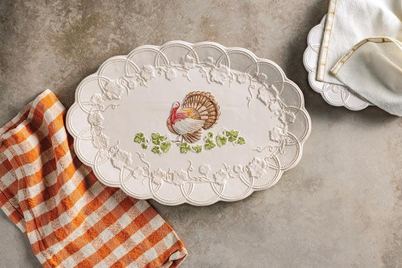 Stoneware turkey platter with scalloped edge in neutral tone