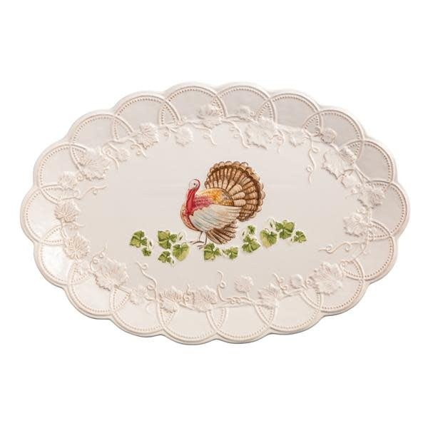 Stoneware turkey platter with scalloped edge in neutral tone