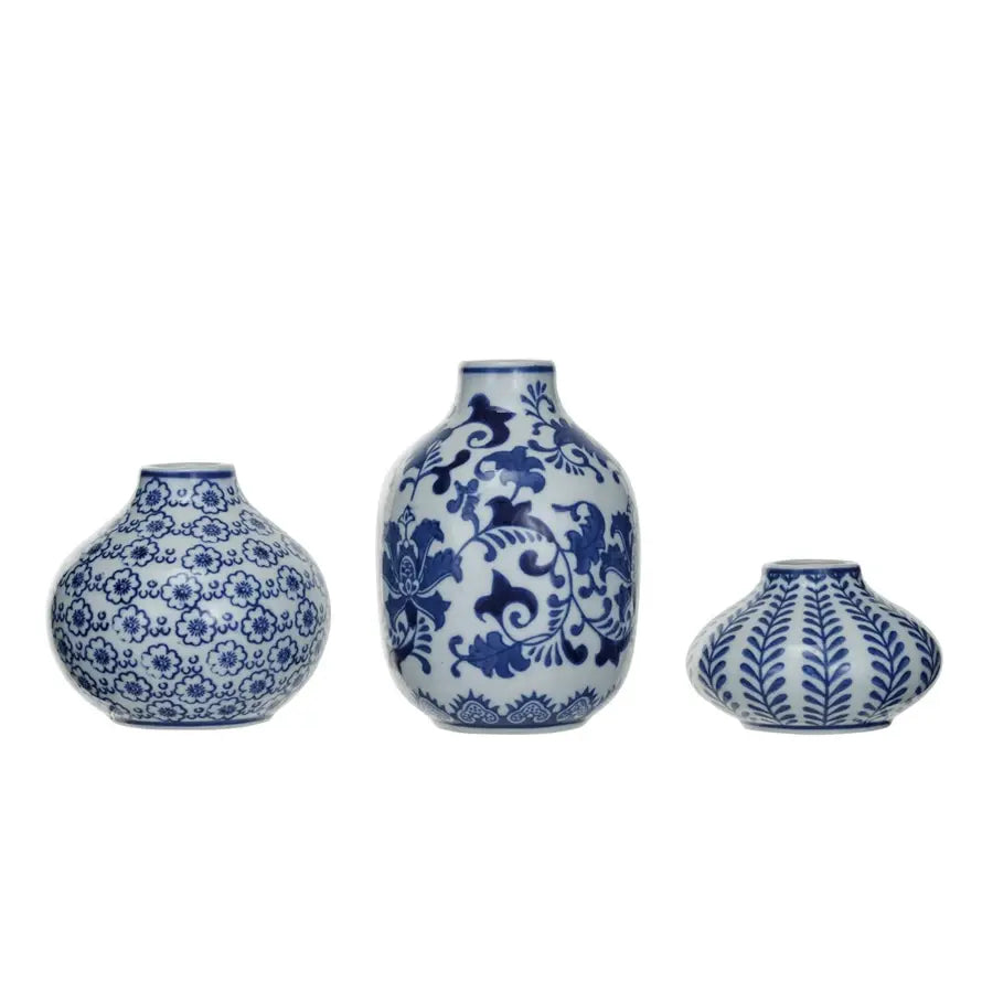 Blue and white stoneware vase with a square silhouette featuring hand-stamped geometric patterns.