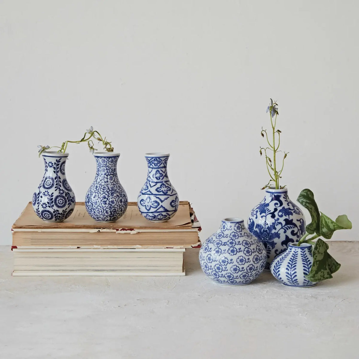 Blue and white stoneware vase with a square silhouette featuring hand-stamped decorative patterns.