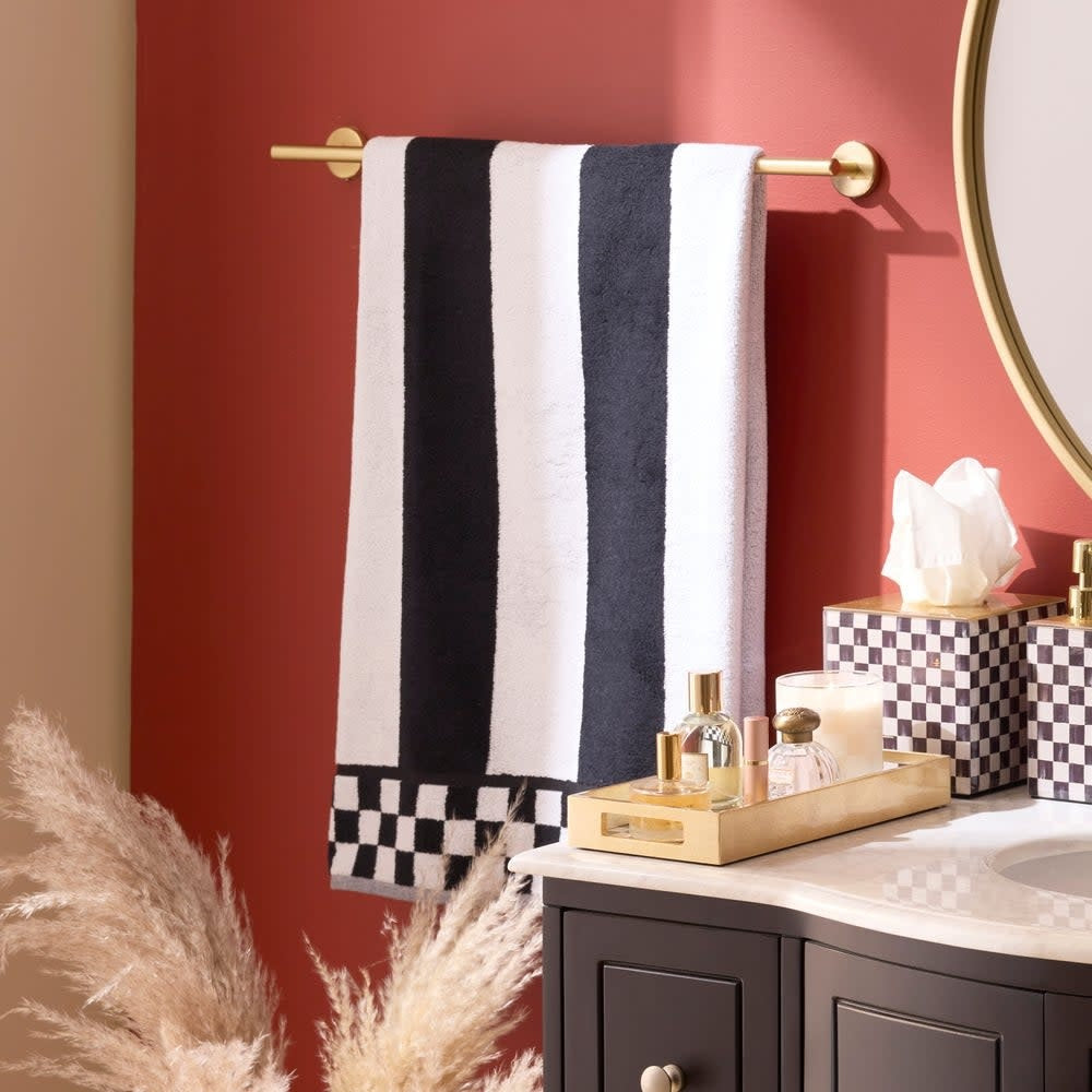 Plush cotton bath towel with horizontal stripes in contrasting tones.