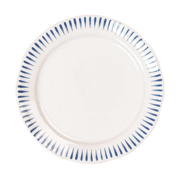 White ceramic dinner plate with Delft blue rimmed stripes on a whitewash glaze.