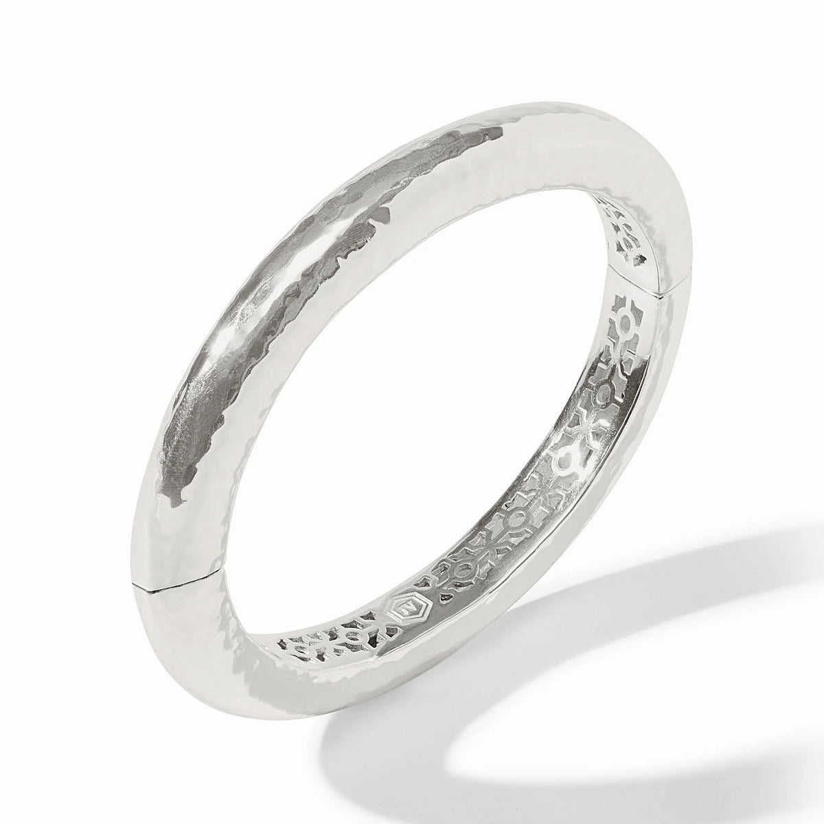Silver Catalina hinge bangle with a hammered texture and decorative interior pattern.