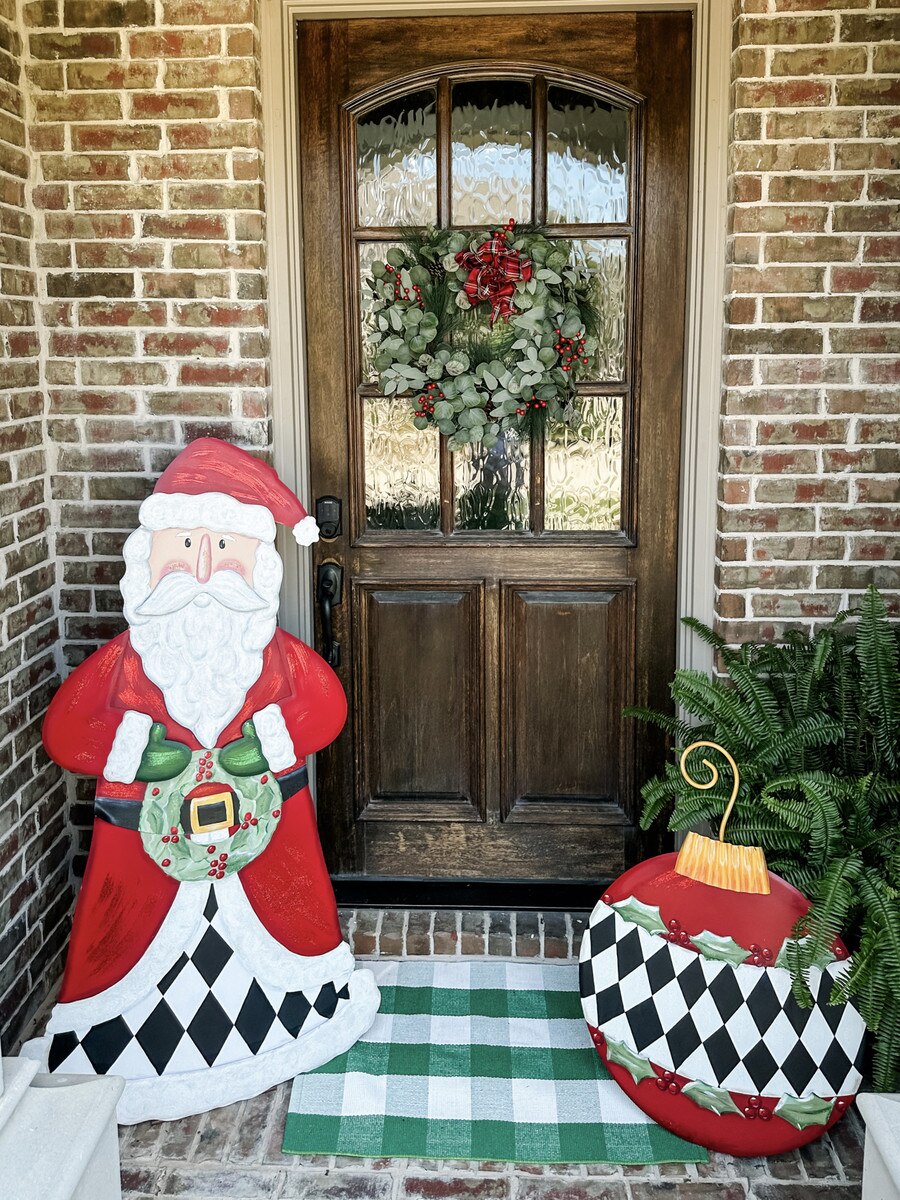 Elegant Santa Yard stake decoration in red fabric with white trim.