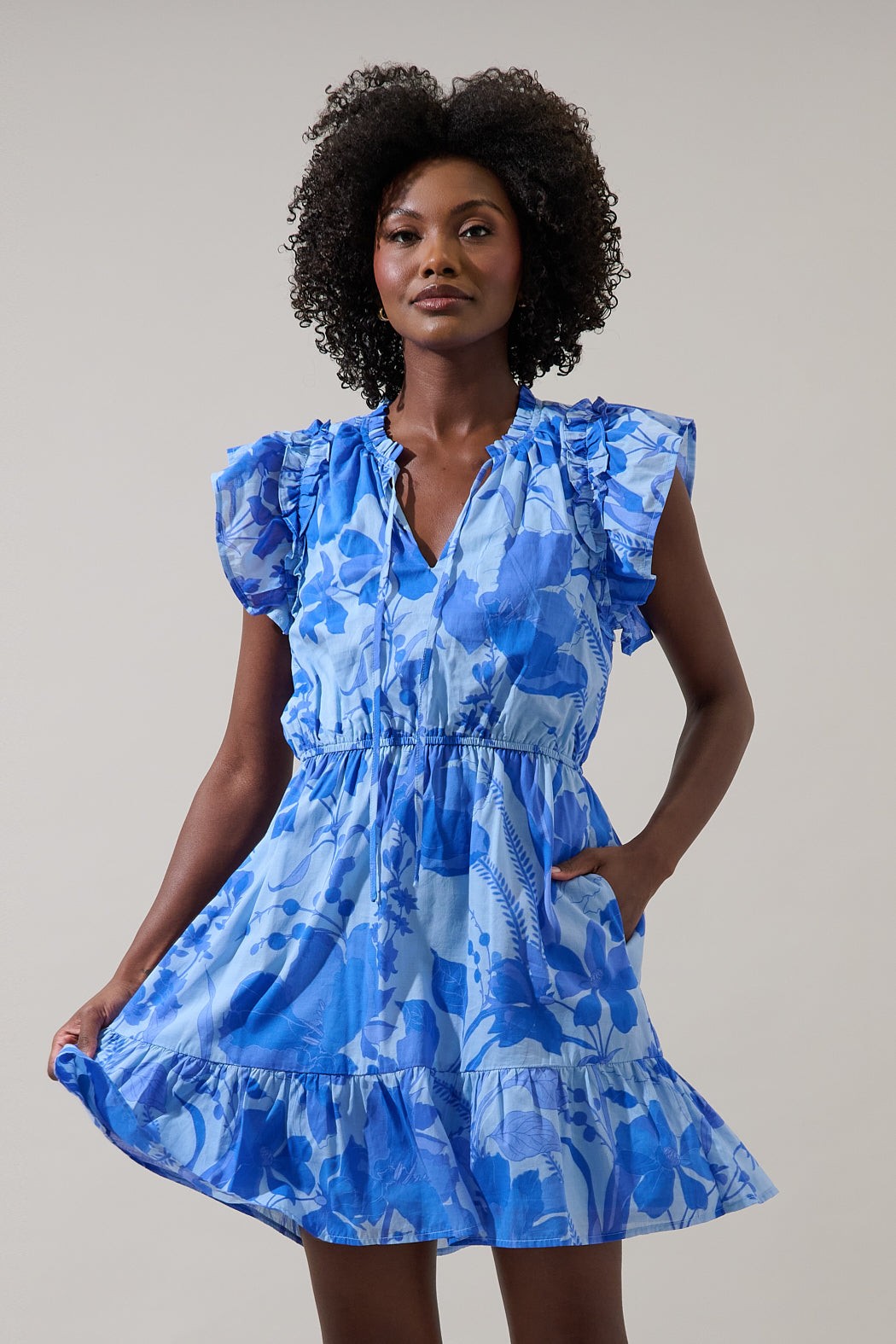 Veran Floral Sardy mini dress in cotton with rayon lining featuring a floral pattern and side pockets.