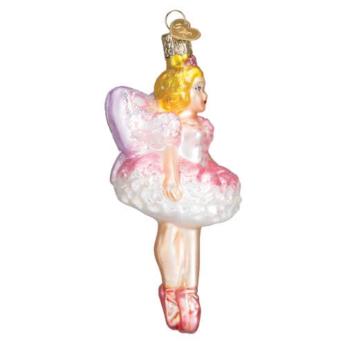 Glass Sugar Plum Fairy ornament with silver wings and pink bodice against a dark background.
