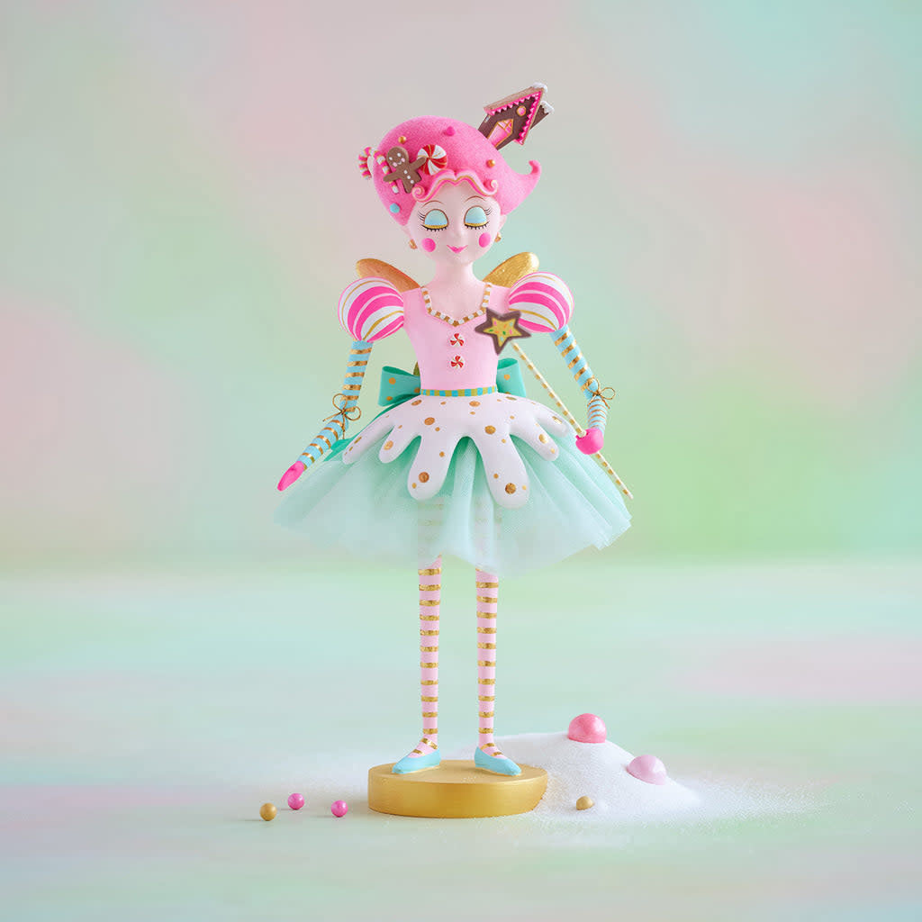 Hand-painted resin Sugar Plum Fairy tabletop figure with gold leaf accents on a dark background.