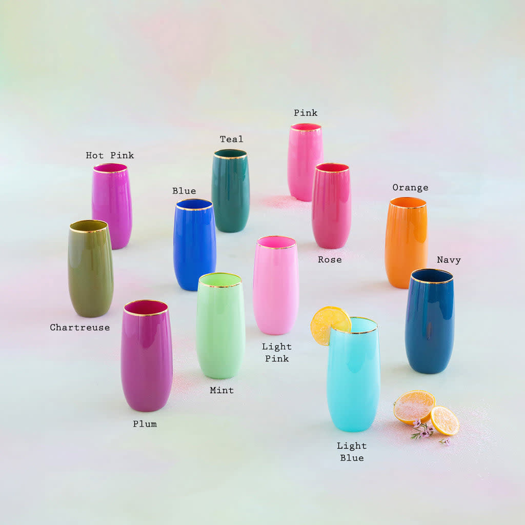Hand-blown glass tumbler with gold trim featuring a whimsical sugar plum pattern in vibrant holiday colors.