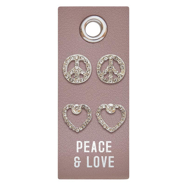 Silver stud earrings featuring a PU leather tag with rhinestone accents.