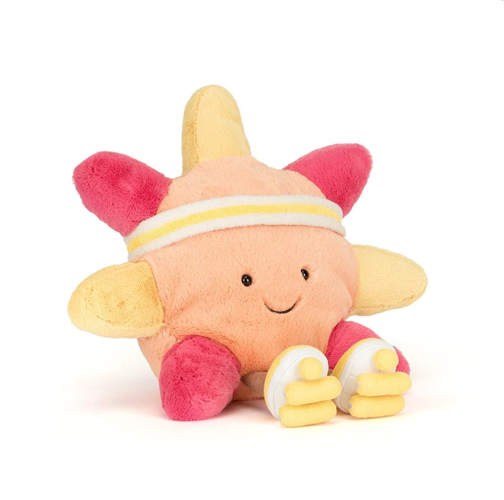 Plush orange sun with pink and yellow rays, wearing a headband and yellow roller skates.
