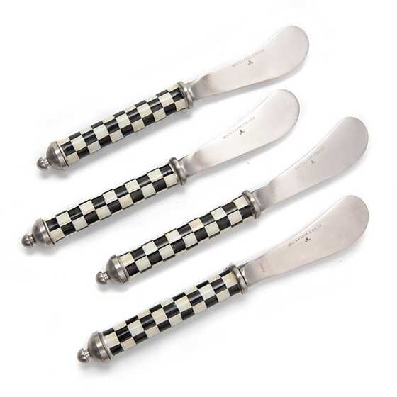 Set of four stainless steel spreaders with Courtly Check enamel patterned handles.