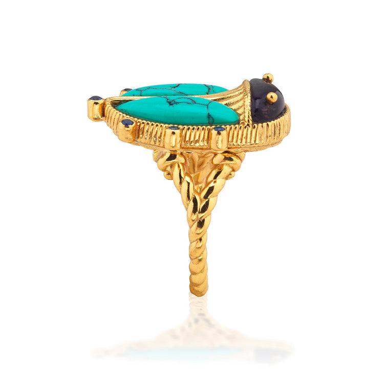 Scarab Grande ring in gold-plated brass with a detailed scarab beetle silhouette and textured band.