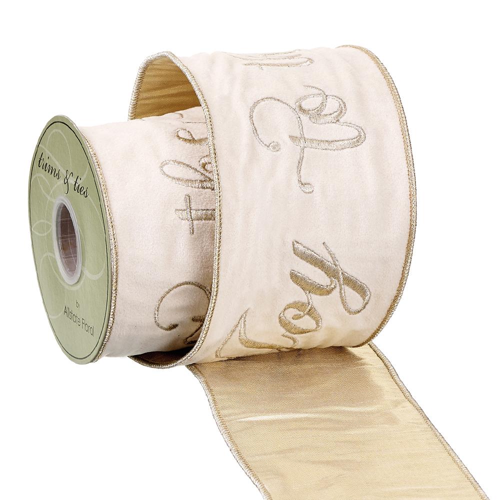 Cream gold woven ribbon with Joy To The World text in a festive pattern.