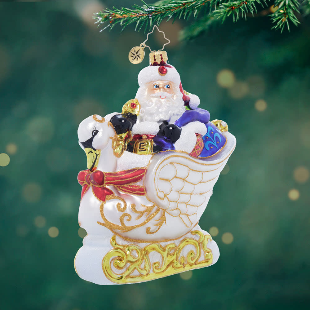 Swan Voyage decorative sleigh ornament shaped like a swan with feathered wings and curved neck in white finish.