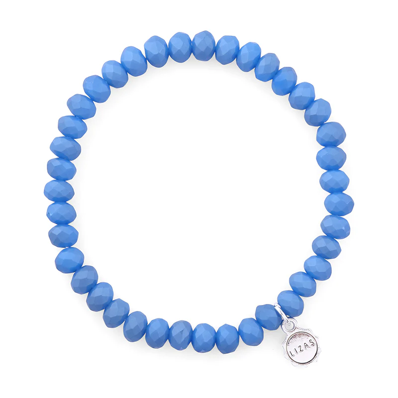 Lizas Quadro Big Bright Colours stretch bracelet with faceted blue crystal beads and silver charm.
