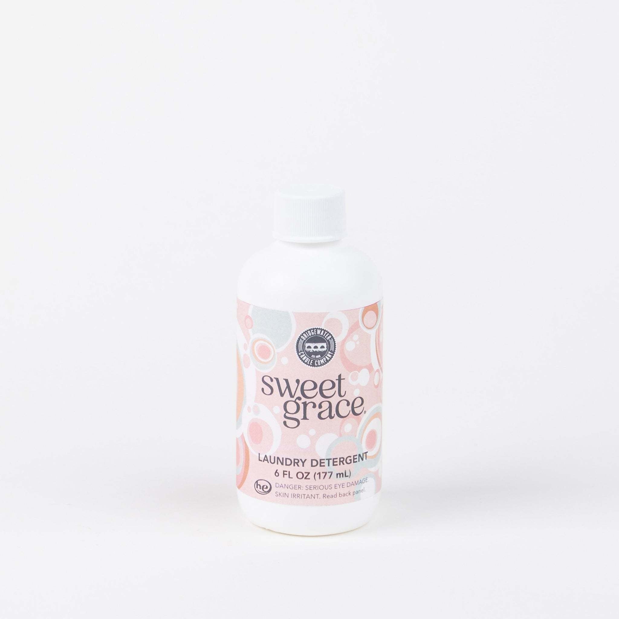 6 oz bottle of Sweet Grace laundry detergent with exotic passion fruit, tea, and patchouli scent.
