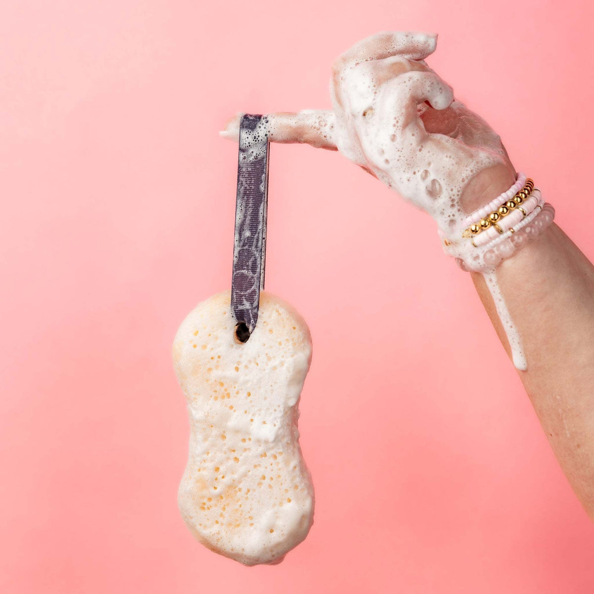 Sweet Grace body wash sponge with rich creamy lather texture