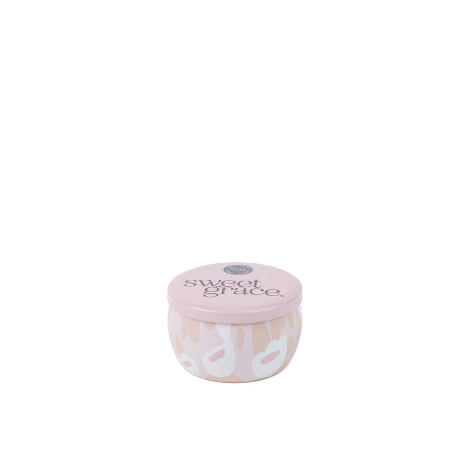 Travel-sized Sweet Grace candle in a tin with blush, grey, white pattern