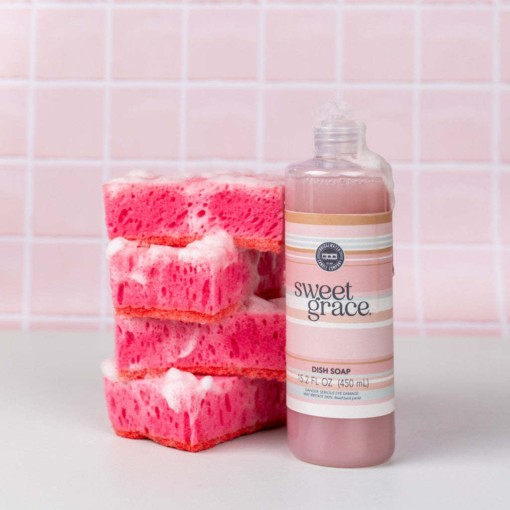 Bottle of Sweet Grace dish soap with sweet grace fragrance in a clear container.