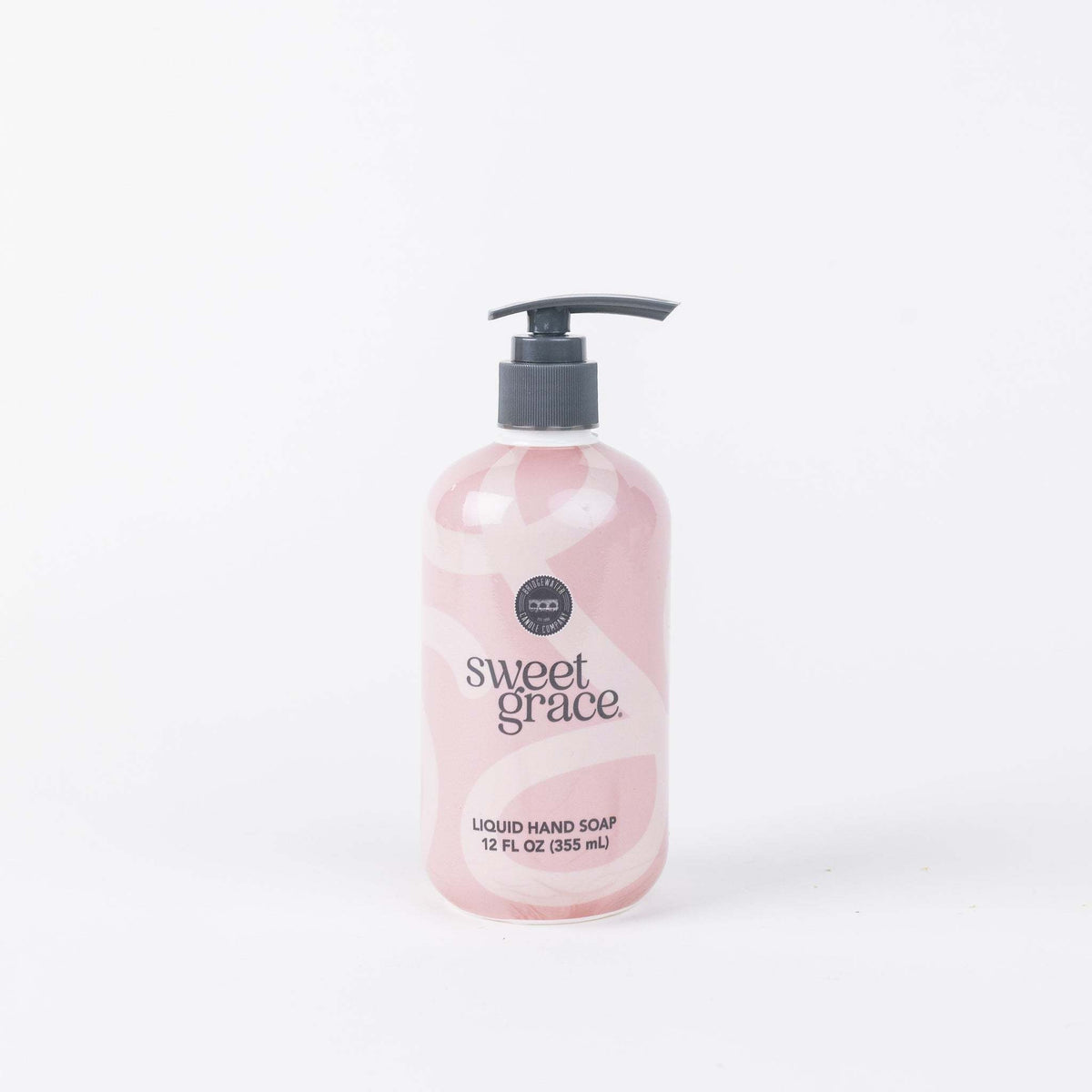 Pump bottle of Sweet Grace liquid hand soap with sweet grace fragrance in a clear container.