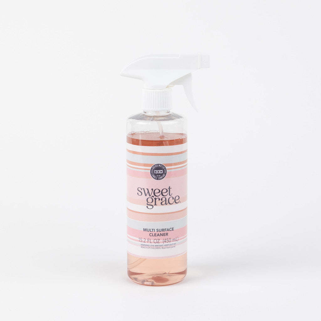 Bottle of Sweet Grace Multi-Surface Cleaner with sweet grace fragrance on a white background.