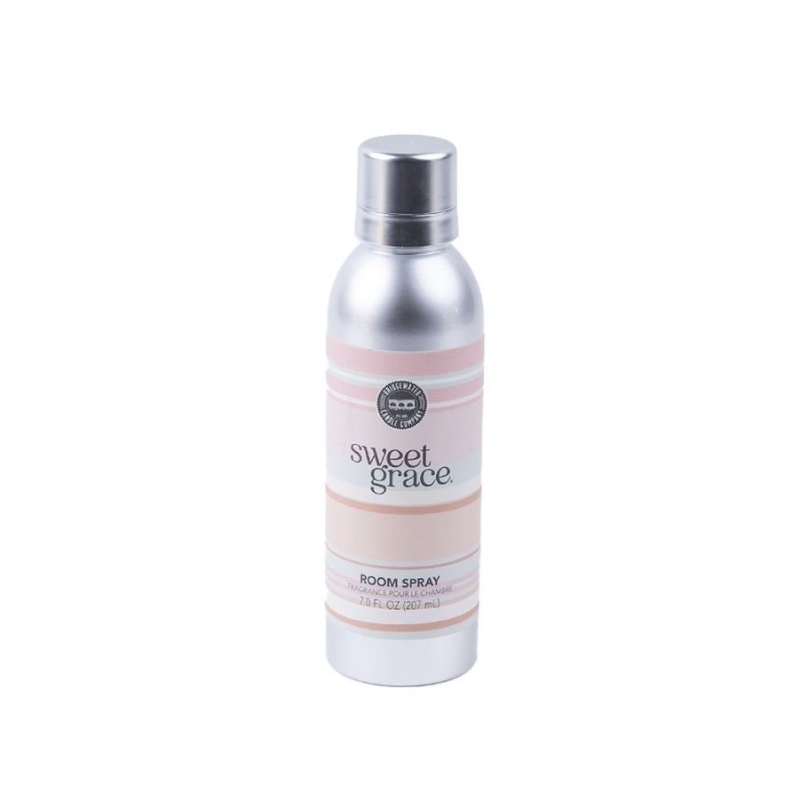 Sweet Grace non-aerosol room spray bottle with a white label featuring exotic passion fruit and patchouli scent details.