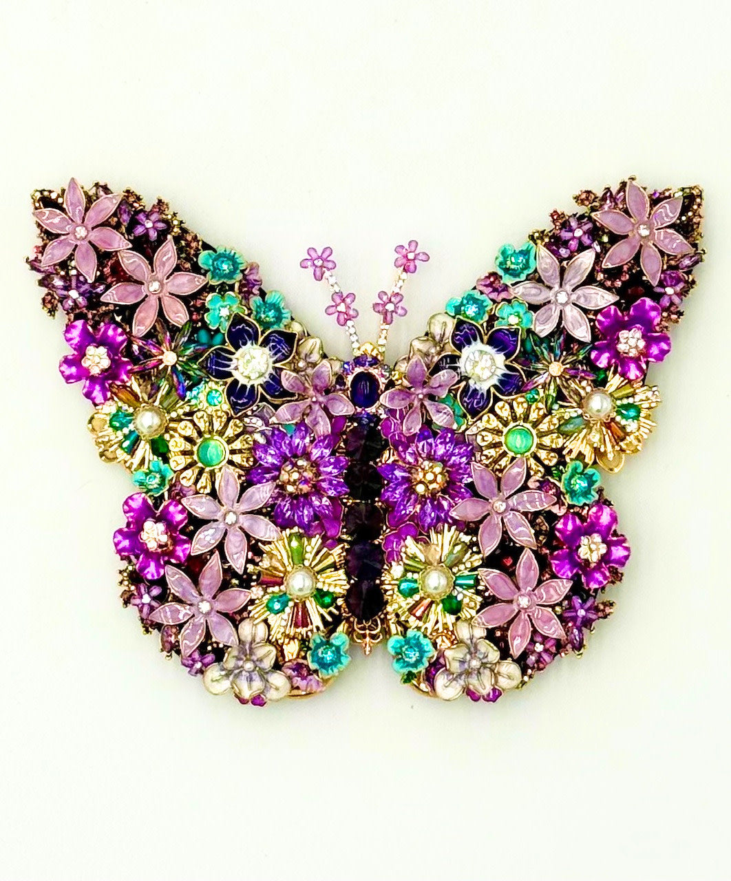 Handmade sweet lilac butterfly wall art with delicate wings.