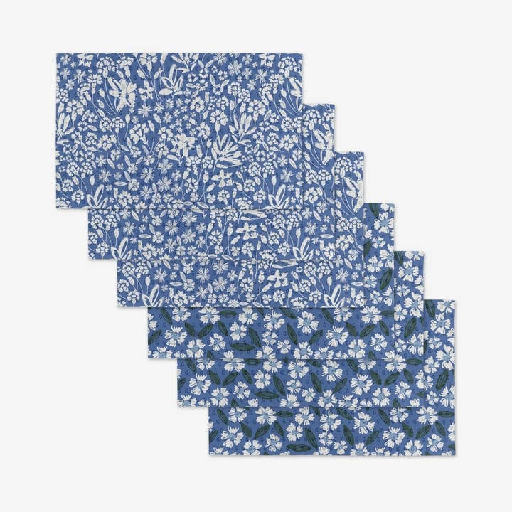 Set of floral-patterned reusable not paper towels made from recycled materials.