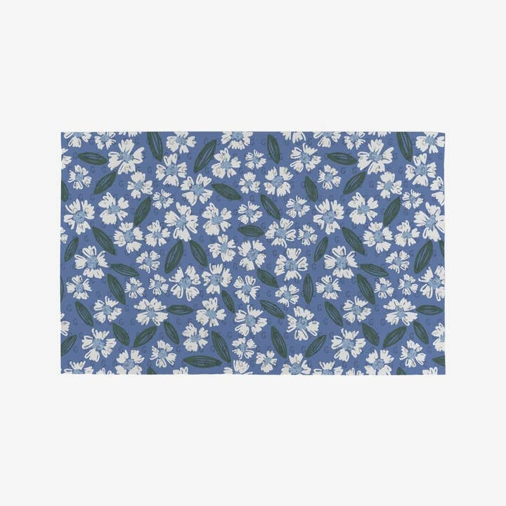 Floral-patterned reusable kitchen towel made from recycled materials in a soft pastel palette.