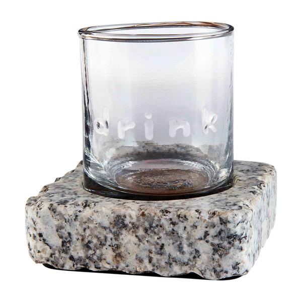 Double old fashioned glass with embossed detailing paired with a square granite chilling stone.