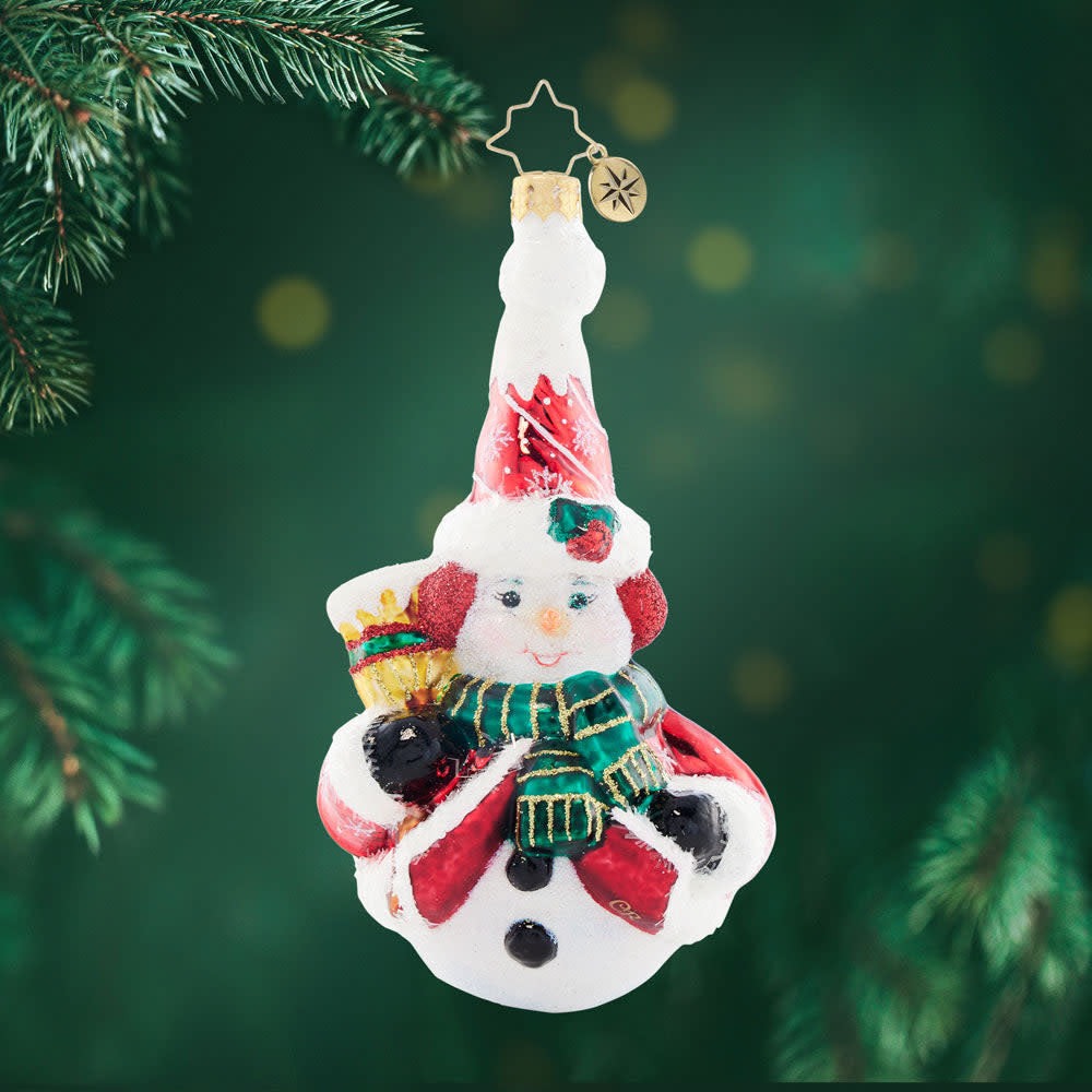 Swept Up Snowman figurine with a broom handle in blue and white snowflake pattern.