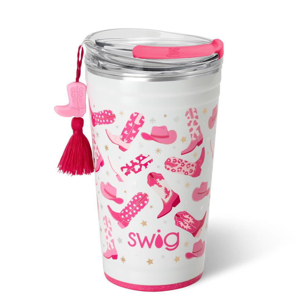 White 24oz insulated stainless steel party cup with pink cowboy boot and hat pattern and tassel.