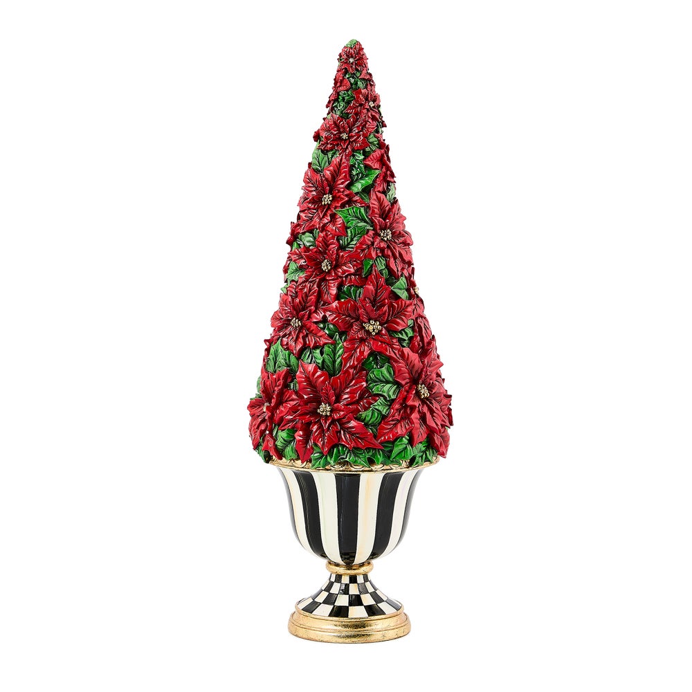 Illuminated poinsettia tree with red flowers and green leaves in a black and white striped urn.