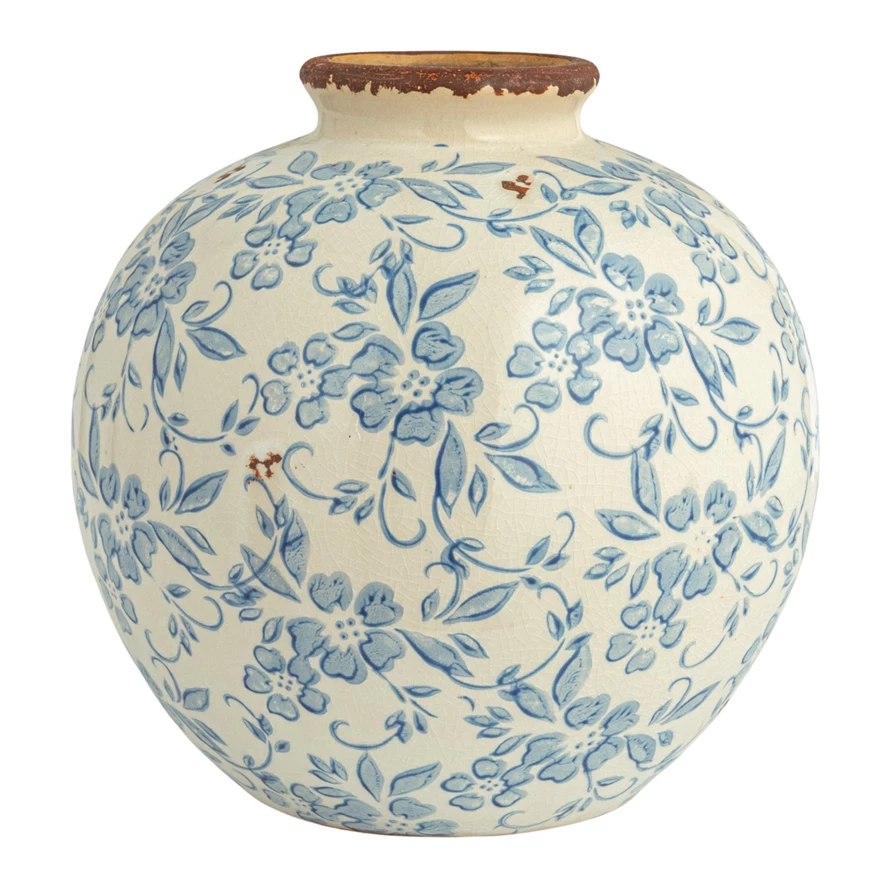 Terracotta round vase featuring a transferware floral pattern.