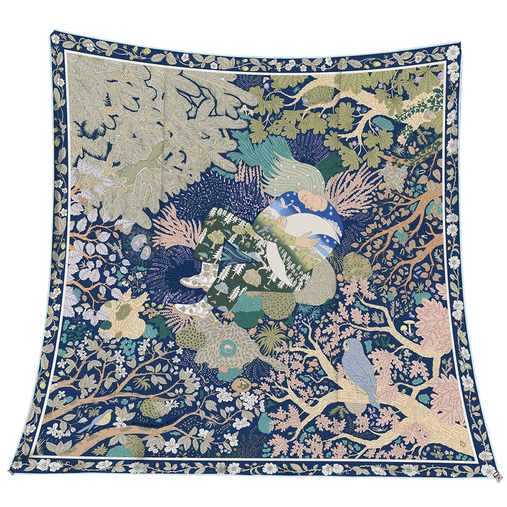 Reversible wool and silk square scarf featuring an intricate blue and green forest illustration.