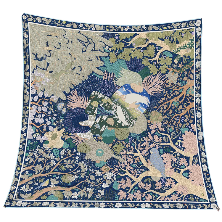 Reversible wool and silk square scarf featuring an intricate blue and green forest illustration.