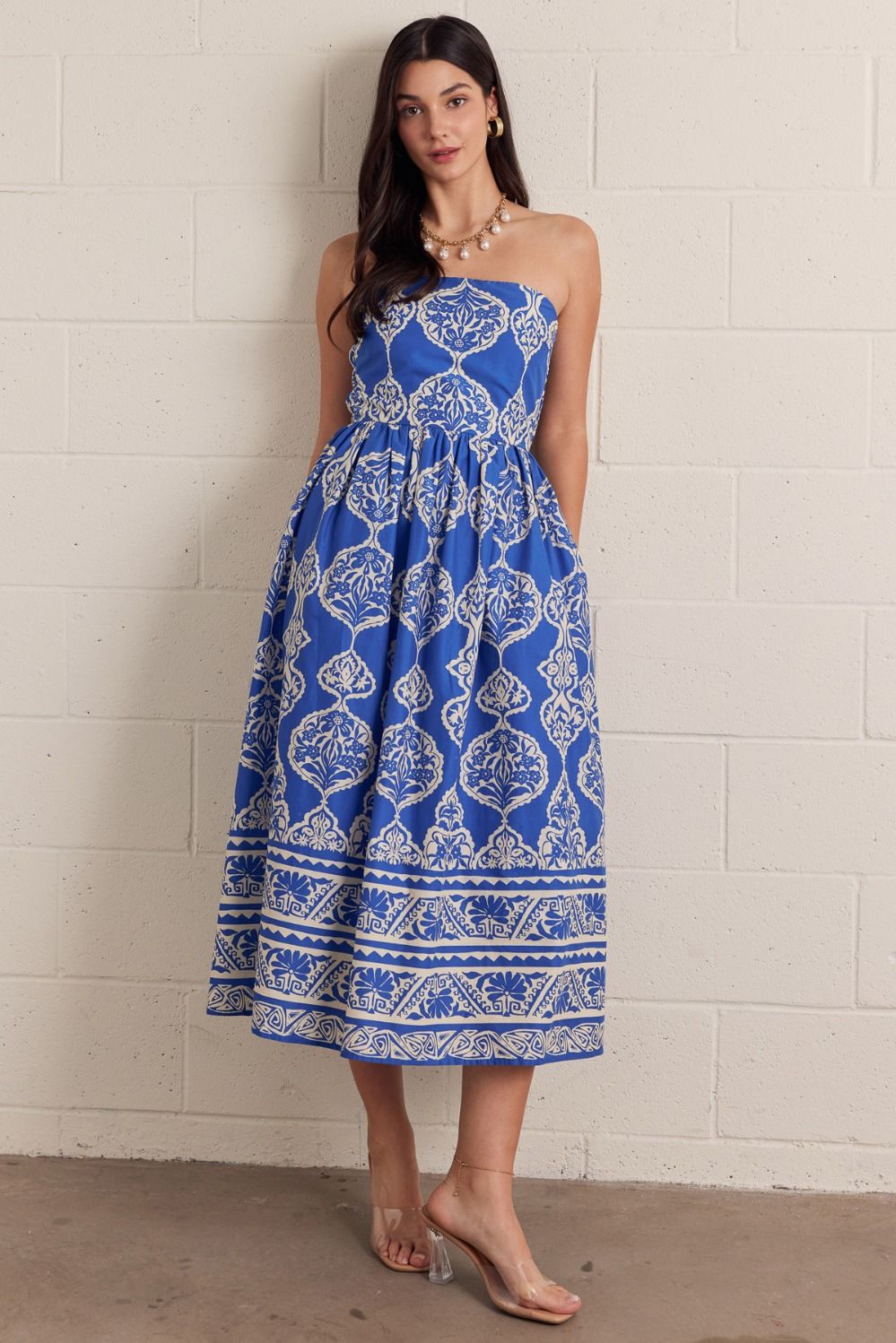 Gabrielle printed strapless midi dress in woven cotton with smocked back bodice and side pockets.